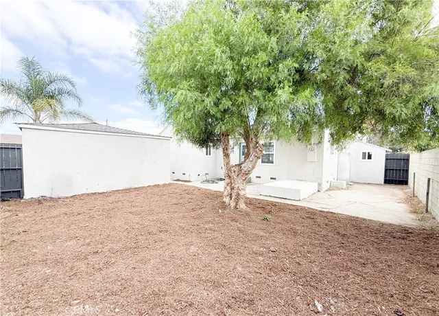 a house with trees in front of it
