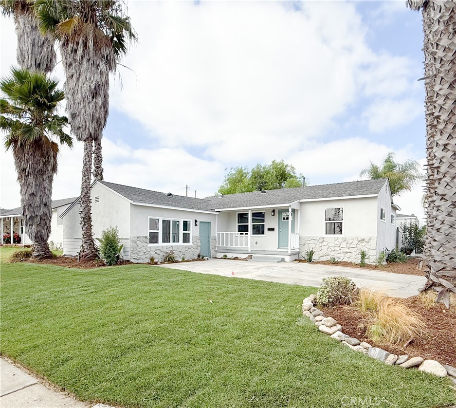 511 North Albertson Avenue Compton, CA 90220 - Photo 3 of 25 a front view of house with yard and trees around
