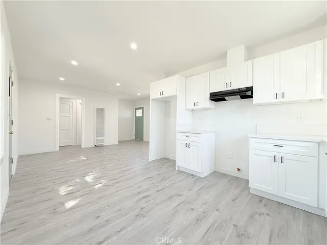 a view of kitchen with wooden floor