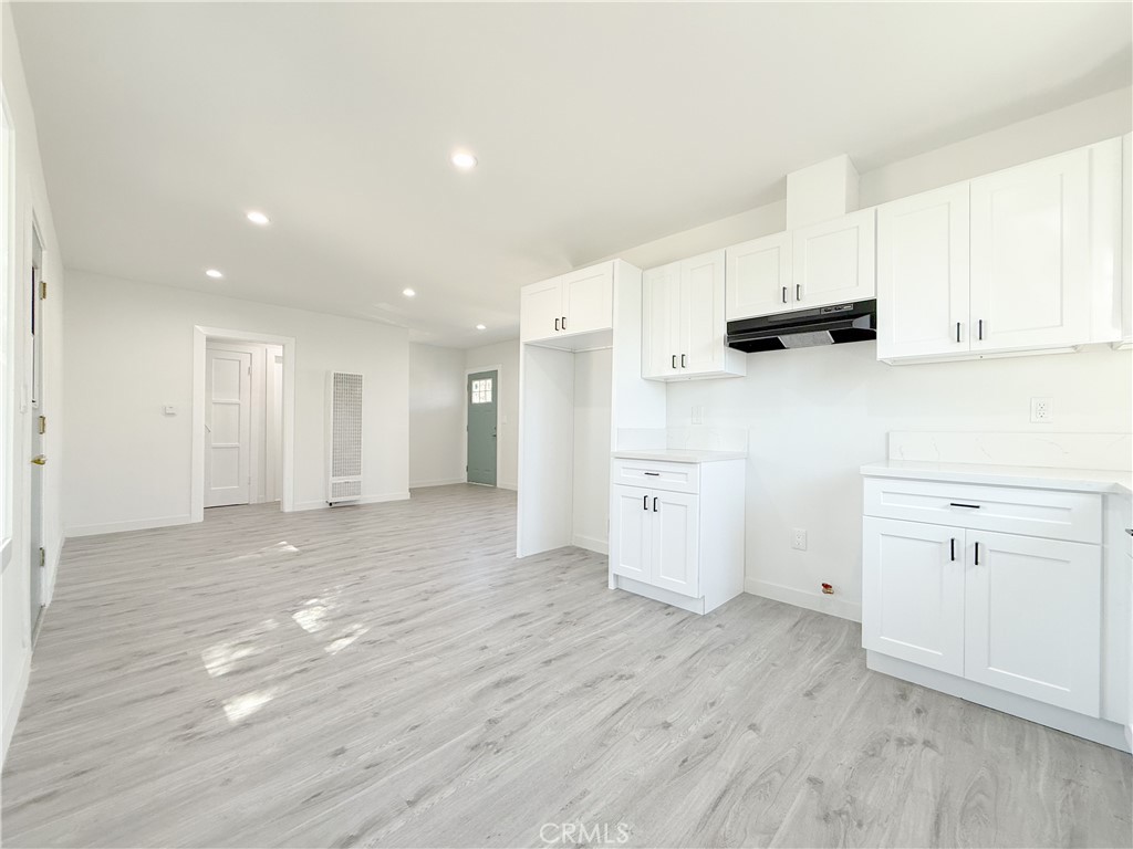 511 North Albertson Avenue Compton, CA 90220 - Photo 7 of 25 a view of kitchen with wooden floor