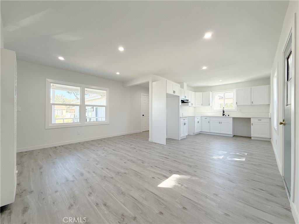 511 North Albertson Avenue Compton, CA 90220 - Photo 10 of 25 a view of a kitchen with wooden floor and windows