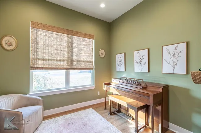 a bedroom with furniture and a window