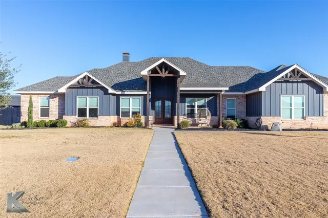 a front view of a house with yard