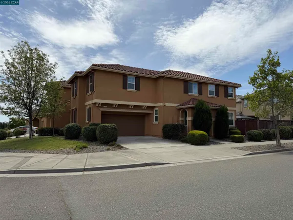 a view of house with yard in front of it