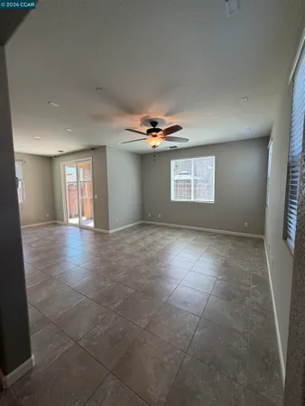 a kitchen with stainless steel appliances granite countertop a sink a stove a refrigerator and a microwave