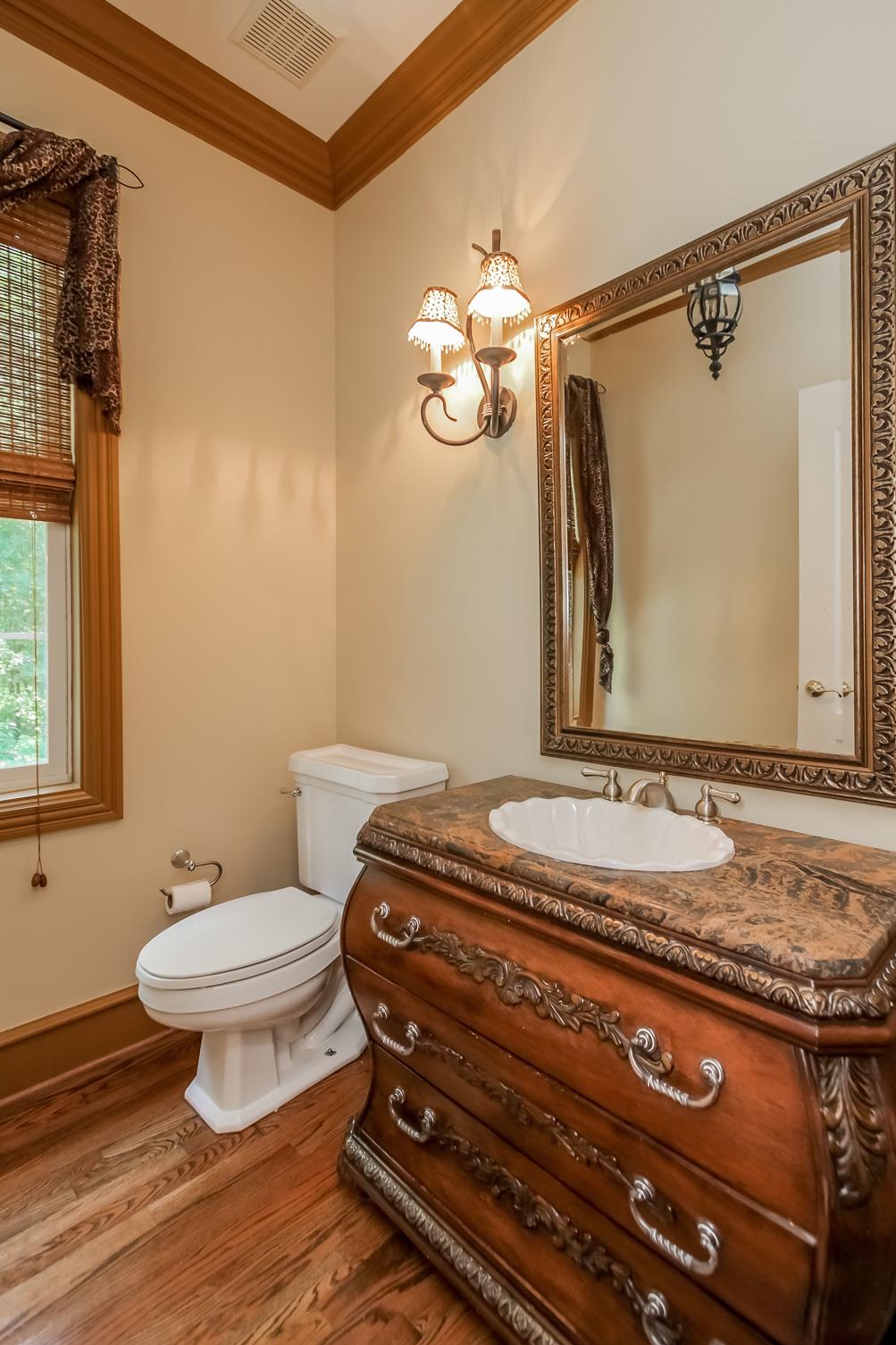 4050 Horn Springs Road Lebanon, TN 37087 - Photo 25 of 29 a bathroom with a granite countertop sink a toilet and a mirror