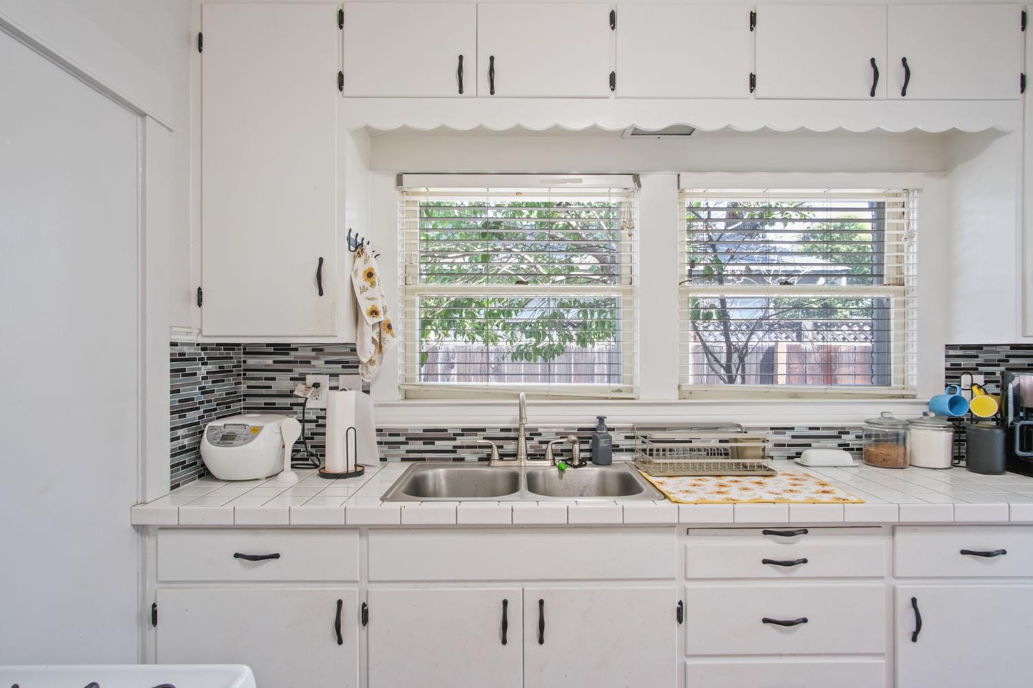930 West Harding Way Stockton, CA 95203 - Photo 16 of 22 a kitchen with appliances cabinets and a window