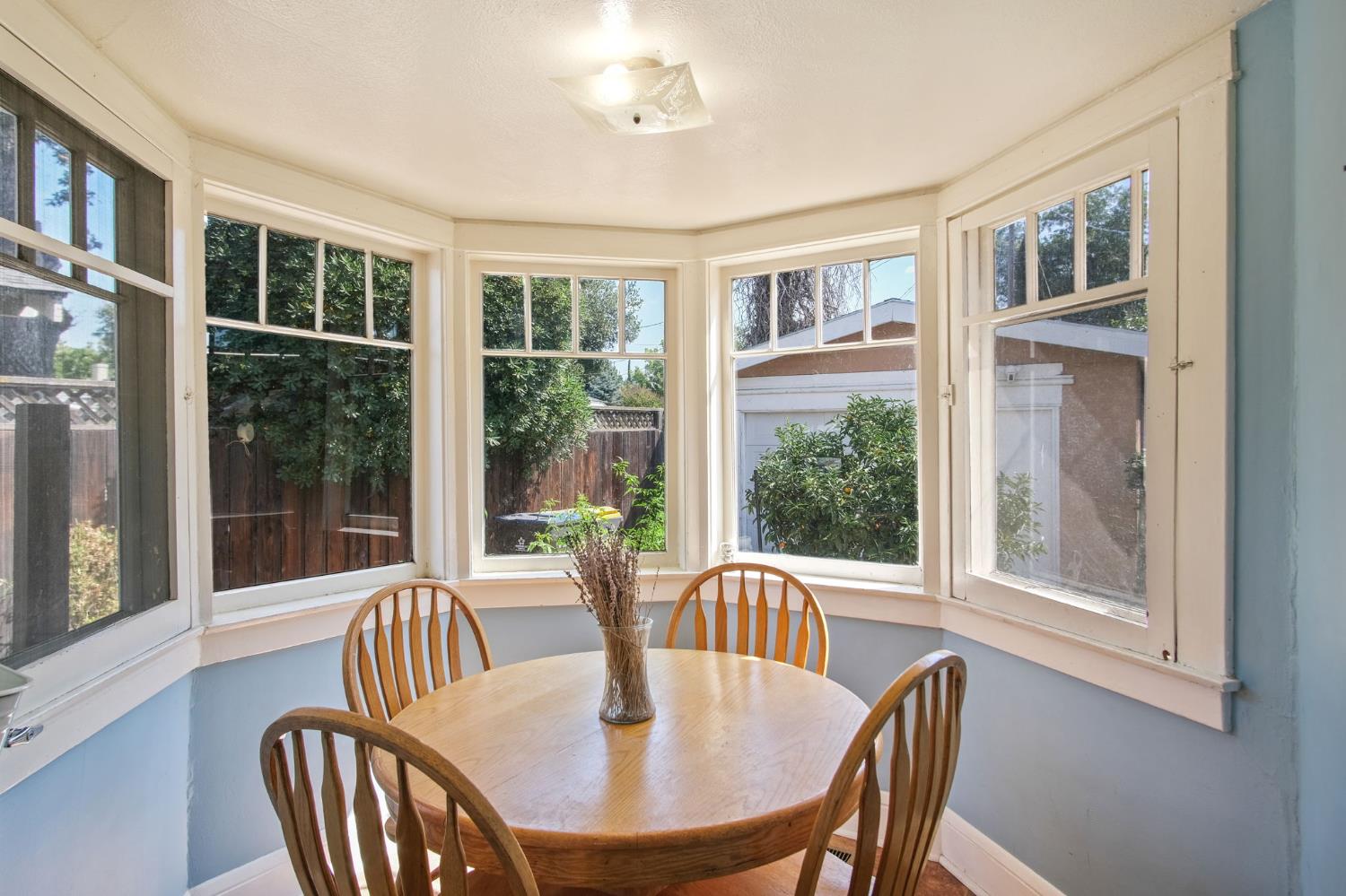 930 West Harding Way Stockton, CA 95203 - Photo 17 of 22 a view of a dining room with furniture window and outside view