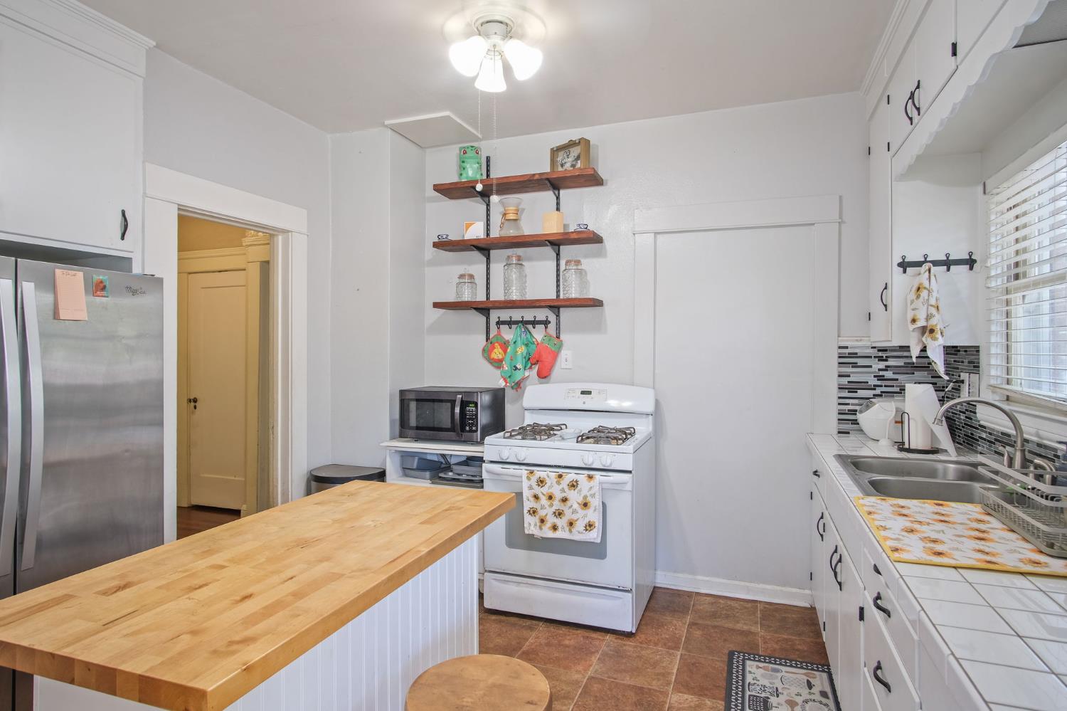 930 West Harding Way Stockton, CA 95203 - Photo 19 of 22 a room with storage and utility