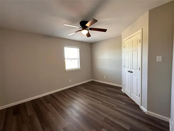 a white toilet sitting next to a shower