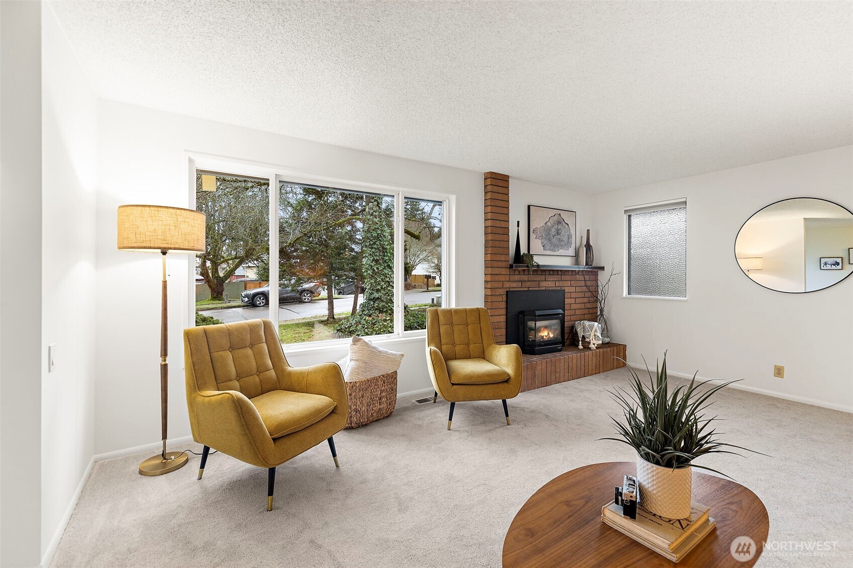 2009 Dayton Drive Southeast Renton, WA 98055 - Photo 3 of 19 a living room with furniture fireplace and a large window