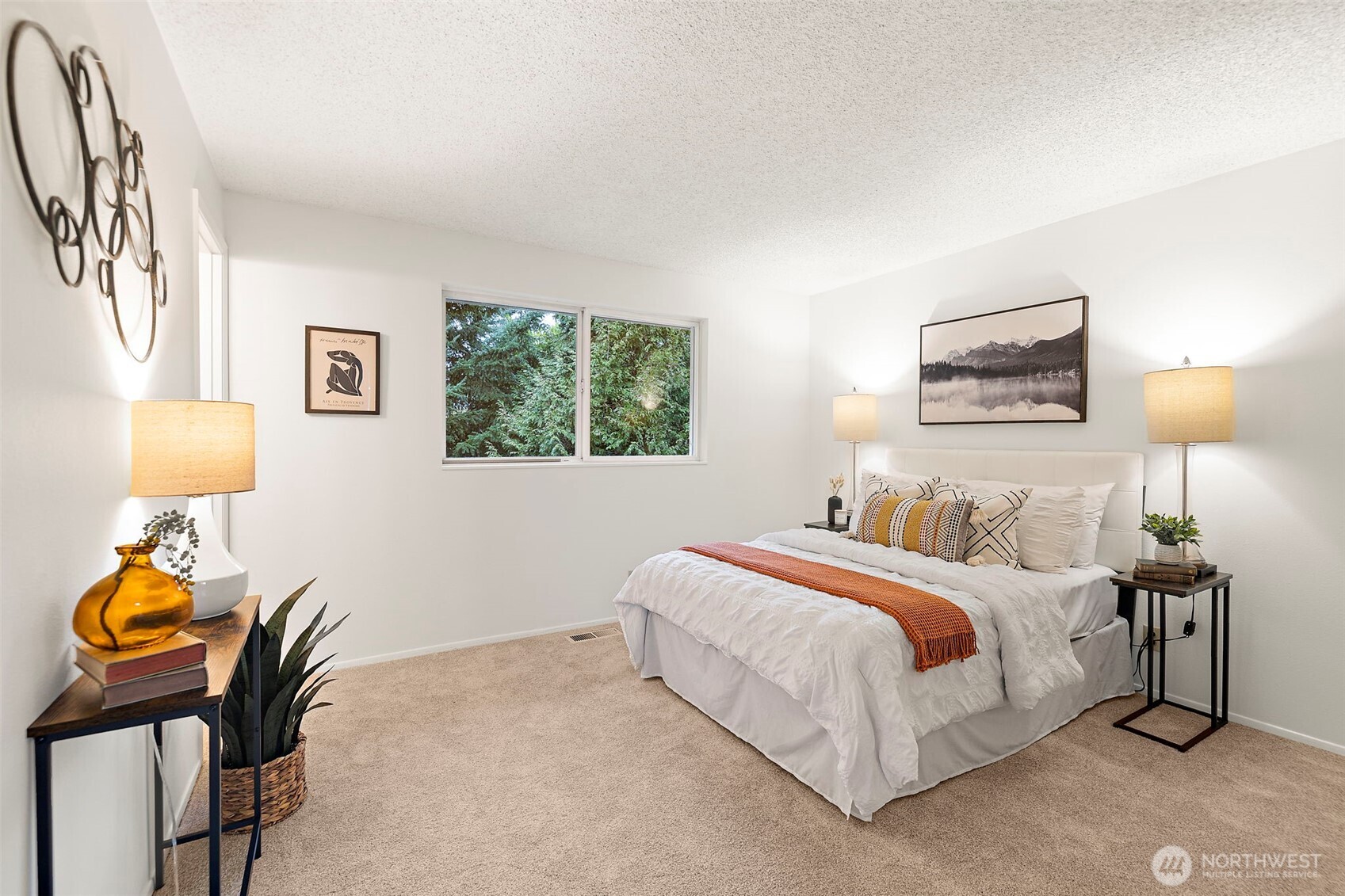 2009 Dayton Drive Southeast Renton, WA 98055 - Photo 6 of 19 a bedroom with a bed and a lamp on dresser