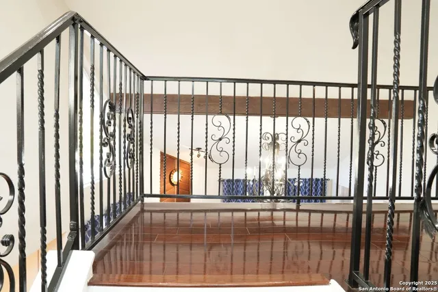 a view of staircase with rug