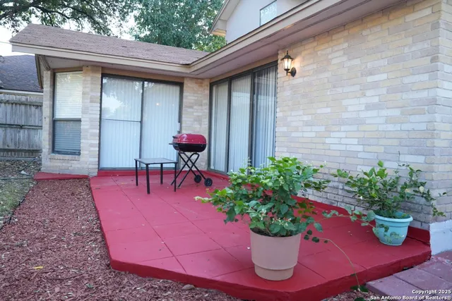a table and chairs in front of a house