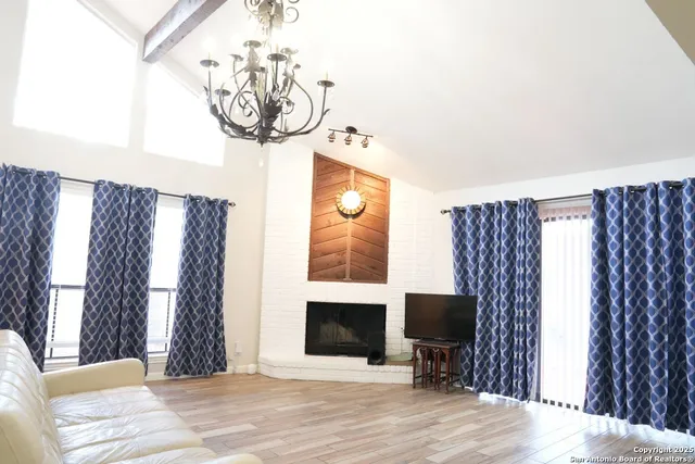 a view of a livingroom with furniture and a fireplace