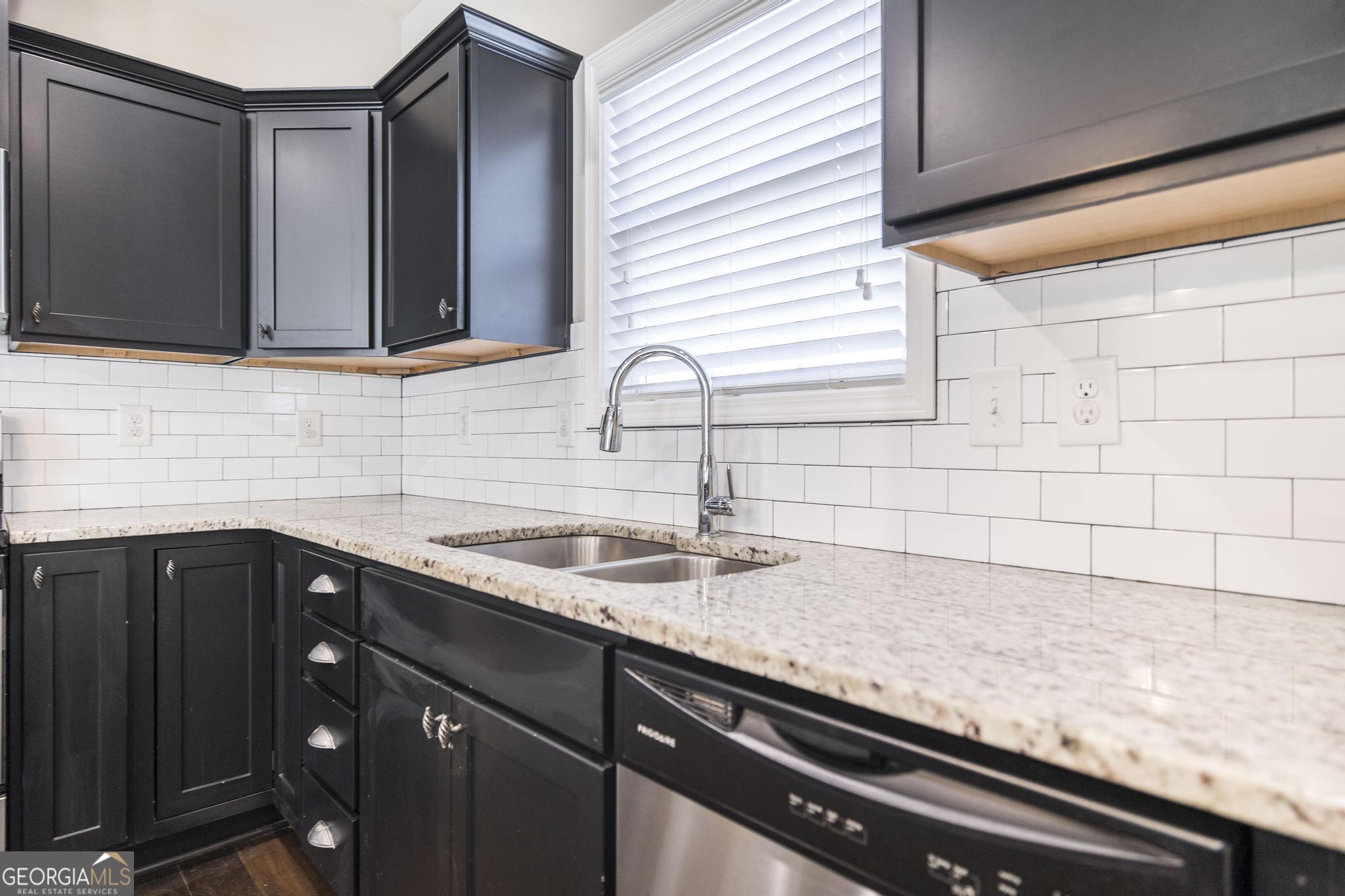 104 Goldenrod Trail Perry, GA 31069 - Photo 12 of 35 a kitchen with a sink and cabinets