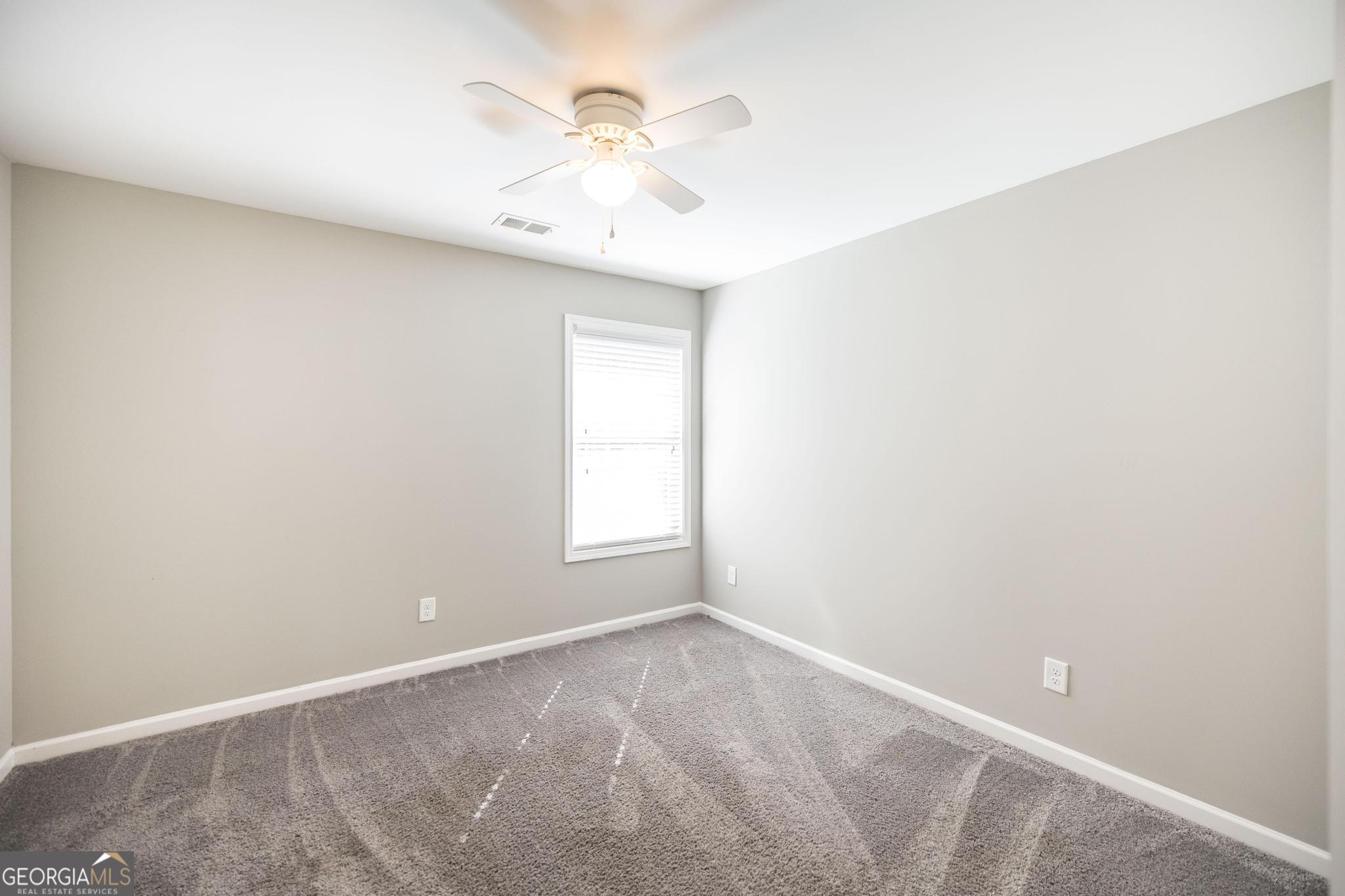 104 Goldenrod Trail Perry, GA 31069 - Photo 24 of 35 an empty room with a window