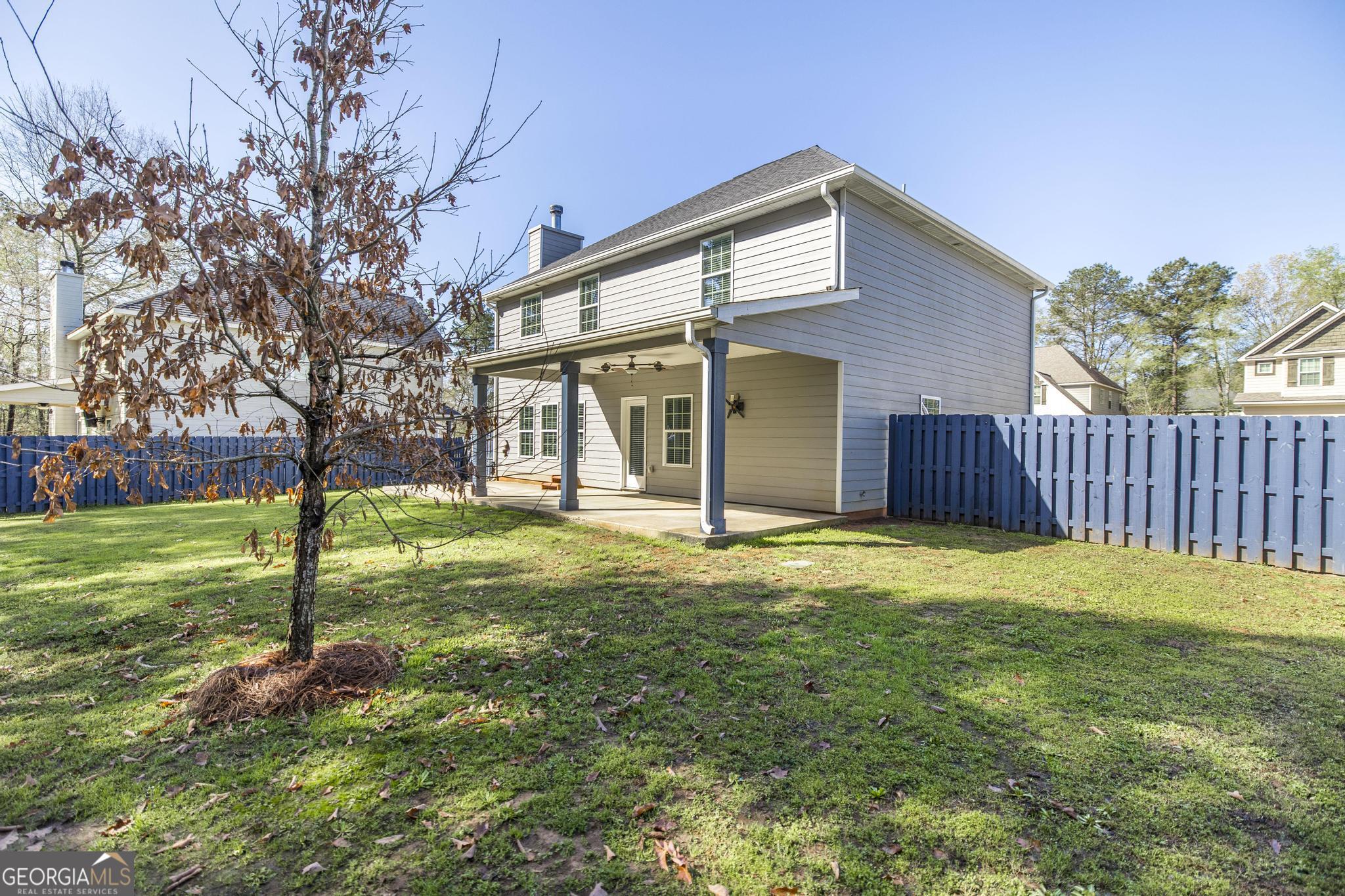 104 Goldenrod Trail Perry, GA 31069 - Photo 32 of 35 a view of a house with a yard and tree s