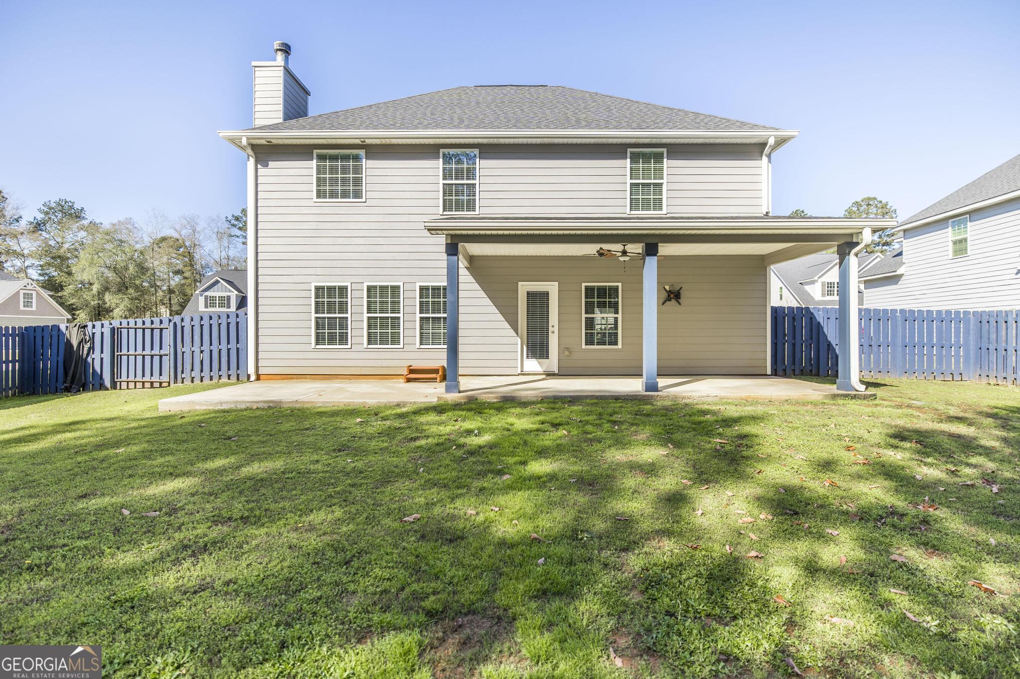 104 Goldenrod Trail Perry, GA 31069 - Photo 33 of 35 a view of a house with a backyard