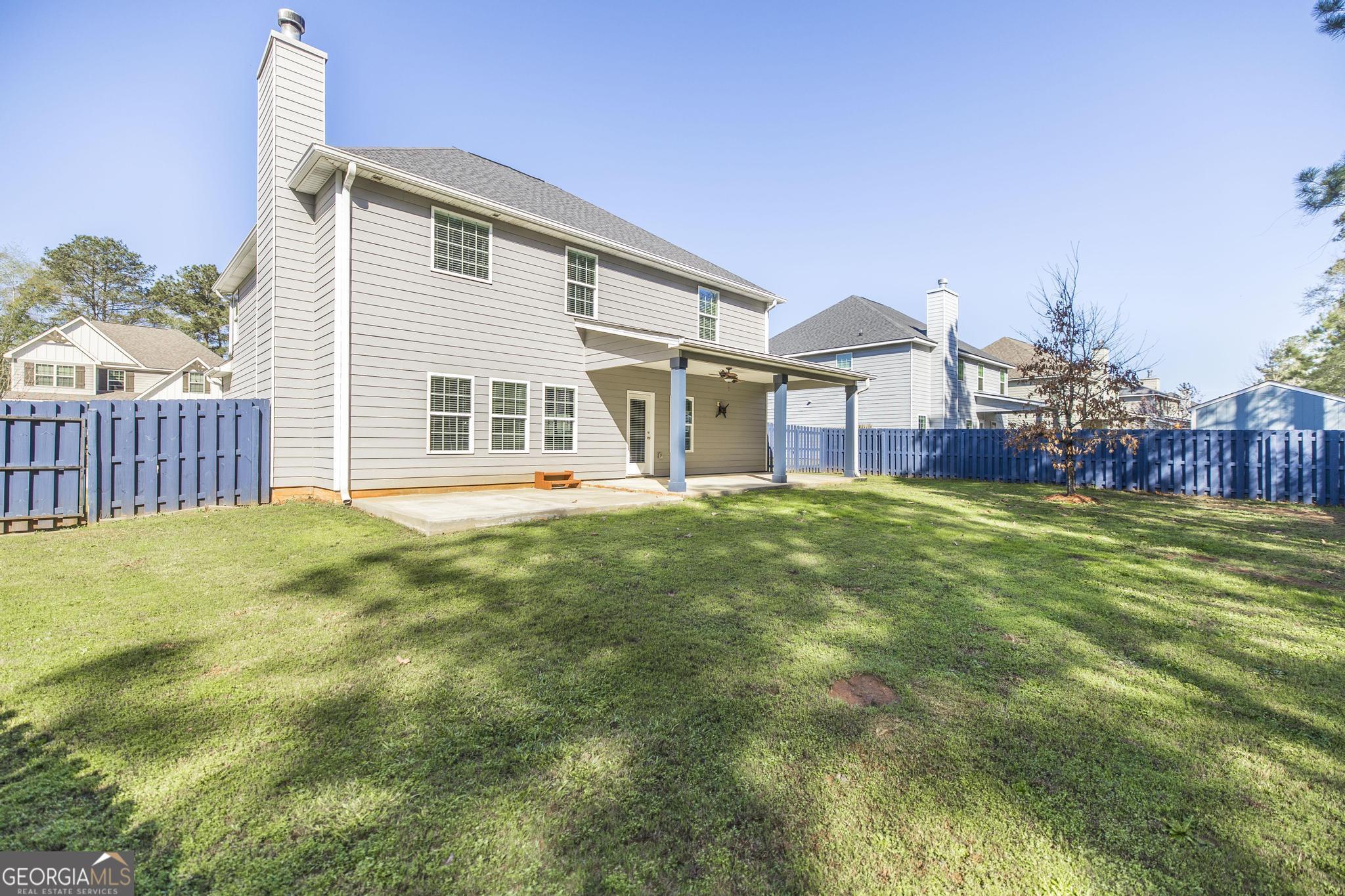 104 Goldenrod Trail Perry, GA 31069 - Photo 34 of 35 a front view of a house with garden