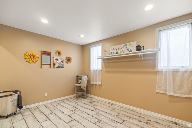 460 Omni Point Road Central Valley, UT 84754 - Photo 54 of 101 Room with distressed wood-finish flooring, recessed lighting, and two windows