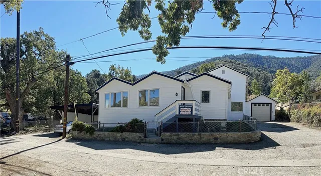 a front view of a house with garage