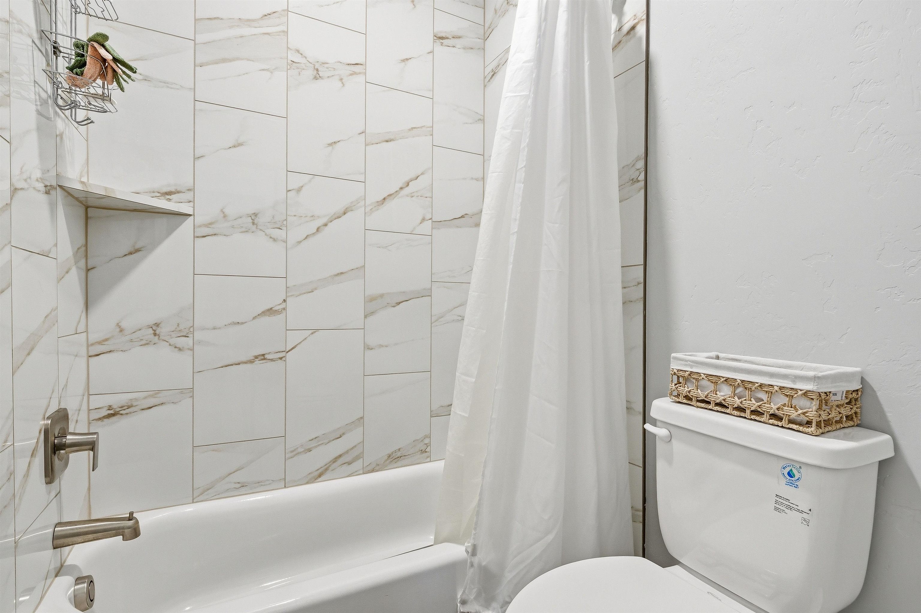 2459 Hamilton Road, Unit A Grand Junction, CO 81505 - Photo 21 of 27 a bathroom with a toilet and a bathtub