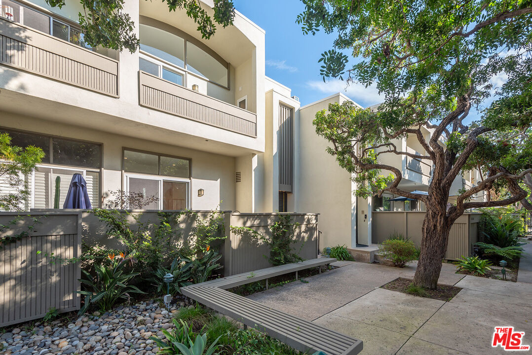 a view of a building with a tree