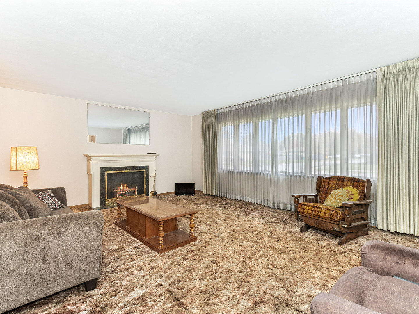 913 Westminster Road Joliet, IL 60435 - Photo 5 of 24 a living room with furniture and a fireplace