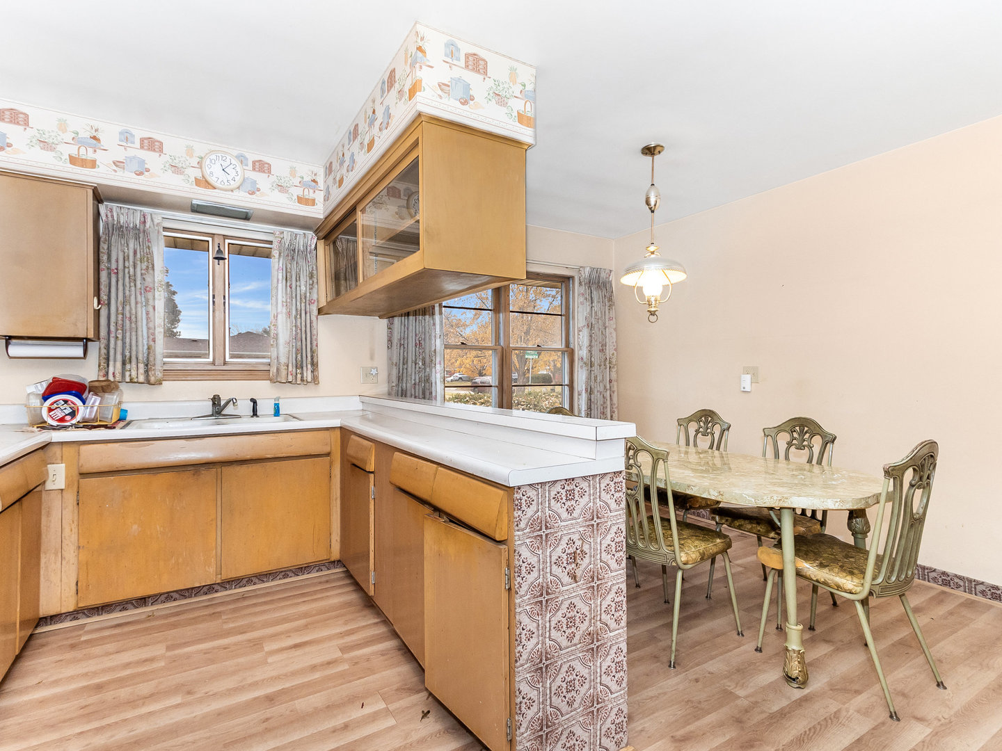 913 Westminster Road Joliet, IL 60435 - Photo 7 of 24 a kitchen with a sink and cabinets