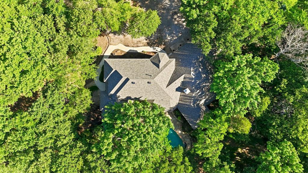 970 Crystal Cove Oak Point, TX 75068 - Photo 37 of 40 an aerial view of a house with a yard and trees