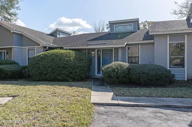 a view of a house with a garden