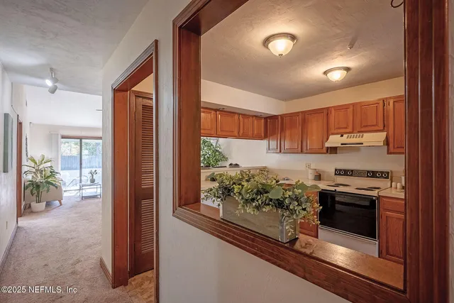 a kitchen with stainless steel appliances granite countertop a stove and a refrigerator