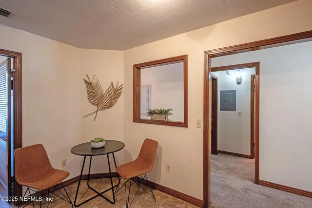 a view of a livingroom with furniture and a table