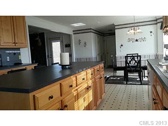 1344 Bowers Road Peachland, NC 28133 - Photo 2 of 15 a kitchen with stainless steel appliances kitchen island granite countertop a sink and cabinets