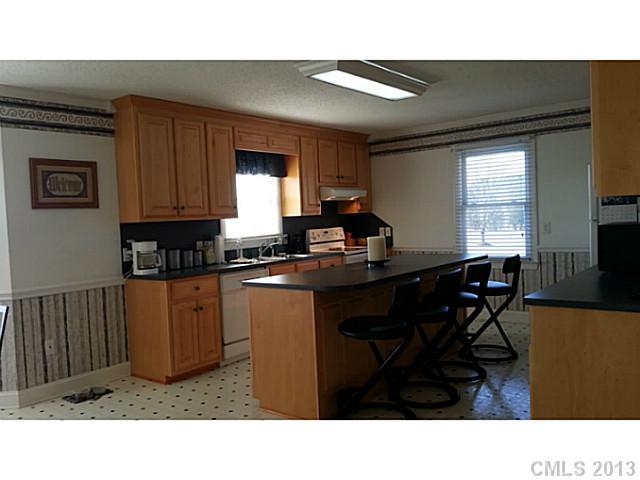 1344 Bowers Road Peachland, NC 28133 - Photo 4 of 15 a kitchen with a sink cabinets and window