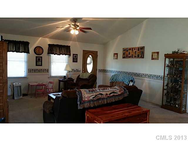 1344 Bowers Road Peachland, NC 28133 - Photo 5 of 15 a living room with furniture and a flat screen tv