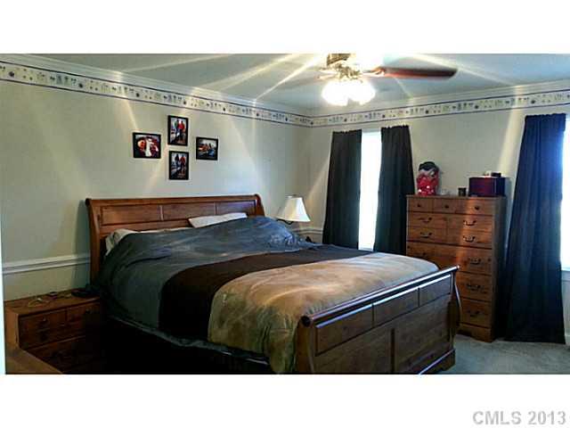 1344 Bowers Road Peachland, NC 28133 - Photo 7 of 15 a room with a bed and a mirror