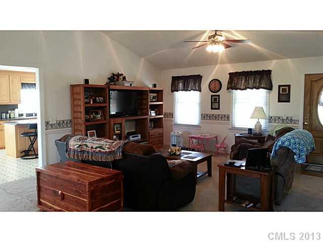 1344 Bowers Road Peachland, NC 28133 - Photo 8 of 15 a living room with furniture and a flat screen tv