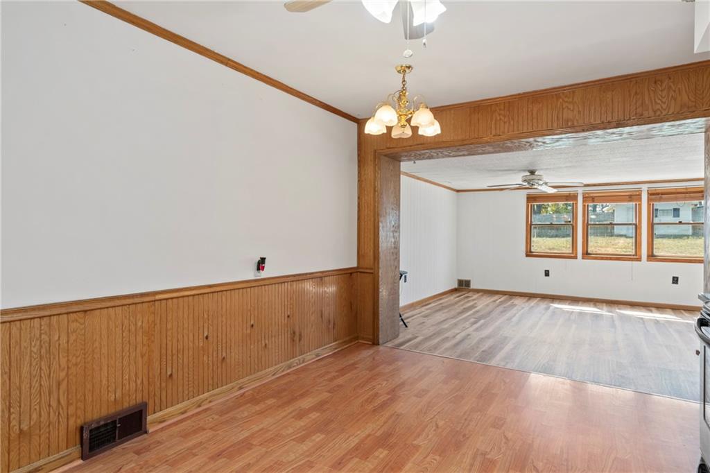 197 Douglass Road Beaver Falls, PA 15010 - Photo 14 of 33 wooden floor in an empty room with a window