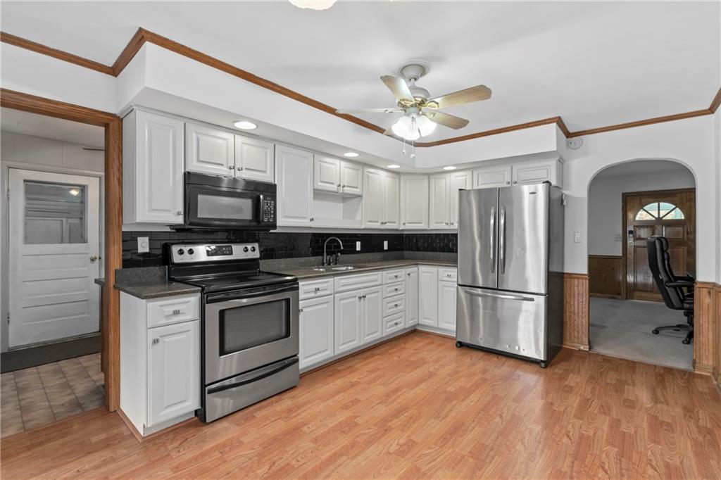197 Douglass Road Beaver Falls, PA 15010 - Photo 16 of 33 a kitchen with stainless steel appliances a refrigerator sink and microwave