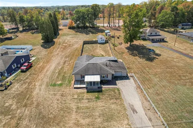 an aerial view of a house with outdoor space