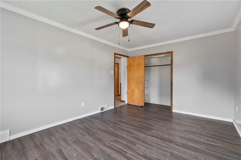 197 Douglass Road Beaver Falls, PA 15010 - Photo 24 of 33 a view of an empty room with window and wooden floor