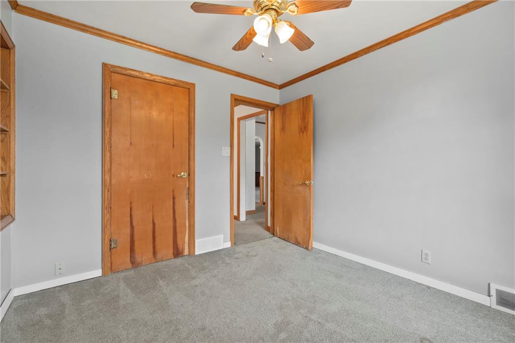 197 Douglass Road Beaver Falls, PA 15010 - Photo 28 of 33 a view of a hallway with a chandelier fan