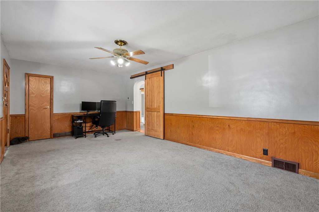 197 Douglass Road Beaver Falls, PA 15010 - Photo 10 of 33 an empty room with furniture and chandelier fan