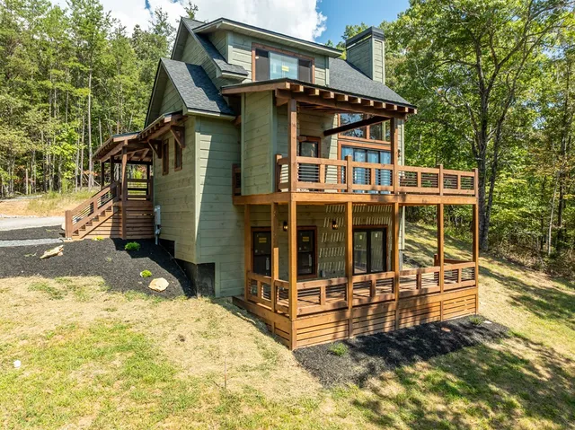 a view of a lush green forest with lots of trees