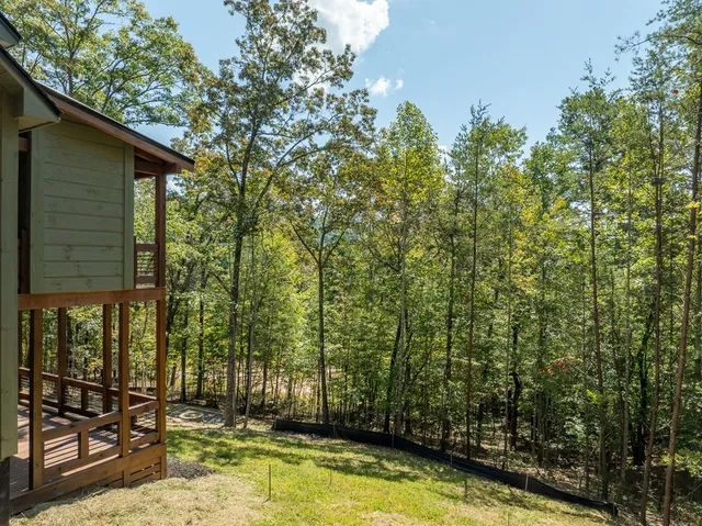 a view of a hallway with wooden shelves