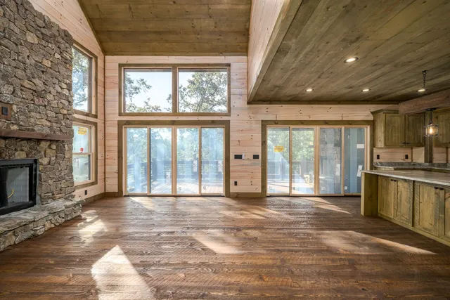 a bathroom with a granite countertop sink and a large mirror