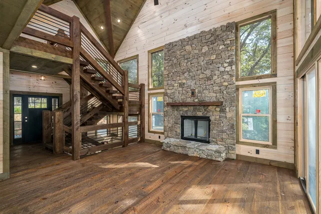 a kitchen with stainless steel appliances granite countertop a sink a stove and a refrigerator