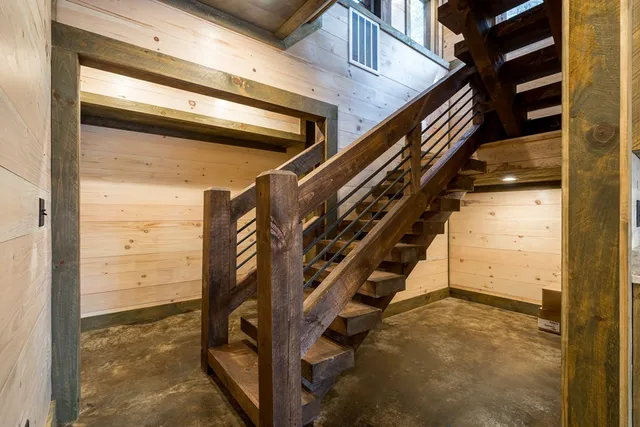 a bathroom with a double vanity sink toilet and shower
